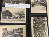 several old black and white photos of people and buildings in a book