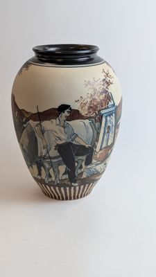 a vase with a picture of a man on a horse drawn carriage