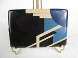 a black suitcase with a blue and white design on it
