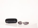 a pair of sunglasses and a case sitting on a table