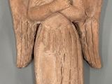 an image of a statue of an angel holding a baby