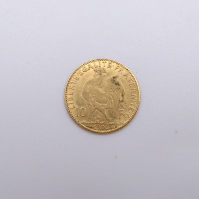 an image of a gold coin on a white surface
