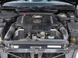a picture of a car engine with its hood open