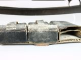 a belt that has a metal buckle on it