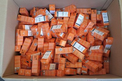 a box full of orange boxes with labels on them