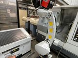 a robot that is standing in front of a machine