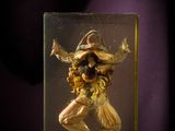 a glass sculpture of a man with a hat on