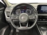 the interior of a car with a steering wheel and dashboard controls