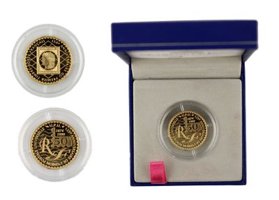 an image of a gold coin in a blue box with a pink ribbon