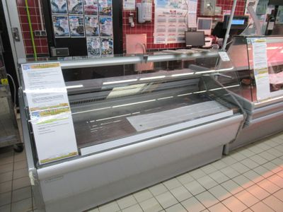a display case in a store with a lot of food on it