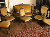 six chairs in a room with a rug on the floor