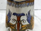 an image of a vase with a bird design on it