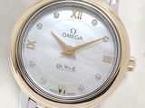 an image of a close up of a wrist watch with roman numerals