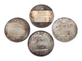 four different types of coins on a white background