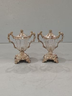 pair of silver plated sugar and pepper shakers