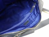 the inside of a blue bag with a zipper on it