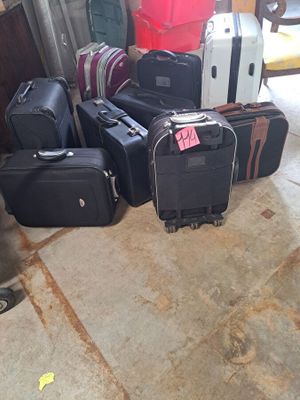 many pieces of luggage sitting on the floor in the garage