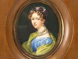 portrait of a woman in a blue dress with a green shawl