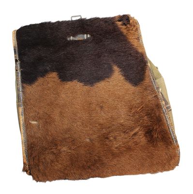 a brown and black cow skin purse on a white background