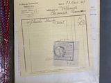 an old document with a stamp on it sitting on a table