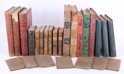 many old books that are stacked on top of each other