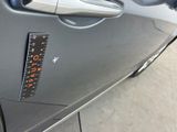 a sticker on the door of a car with a star on it