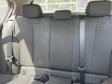the back seats of a car with a seat belt in a car