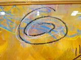 yellow and blue painting with a picture of a clock on it ' s side