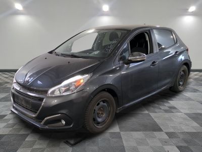 a picture of a gray car parked in a garage