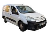 a white van that is parked on the side of the road