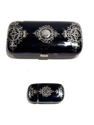 two black and white boxes with designs on them
