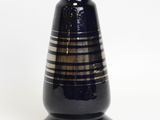 a black vase with a striped design on it