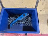 a blue box with a bunch of screws inside of it