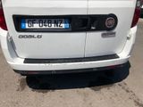a white van that is parked on the side of the road