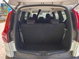 the back of a car with the trunk open and the seats folded down