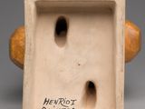 a picture of a ceramic sculpture of a man ' s face