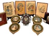 a group of framed pictures of people on a table