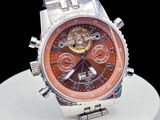 a close up of a watch on a white plate