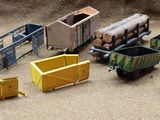 many toy trains that are sitting on the ground