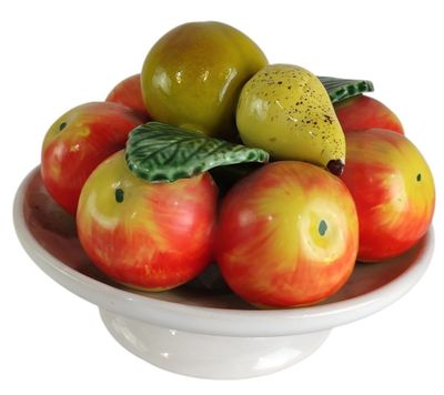 a bowl of apples and pears on a white plate