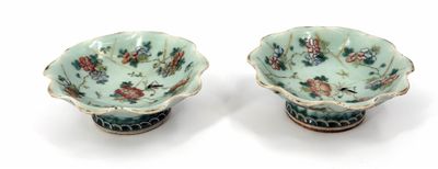 pair of chinese famille bowls with birds and flowers on green ground