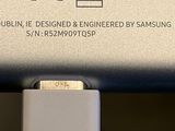 a close up of a usb cable connected to a samsung phone