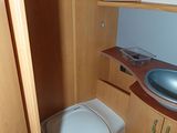 a small bathroom with a toilet and sink in it