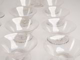 a lot of empty glass bowls and cups on the table