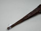 an old baseball bat with a wooden handle sitting on a table