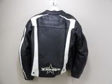 a black and white leather jacket hanging on a wall