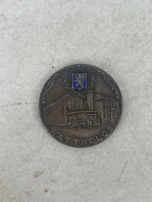 a coin with a picture of a building on it