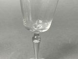 a wine glass that is sitting on a table