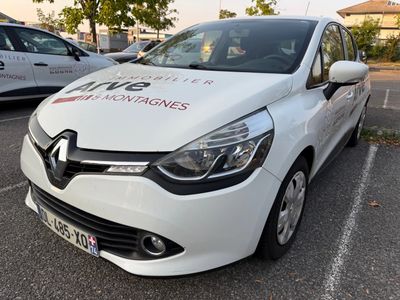 a white car parked in a parking lot next to other cars
