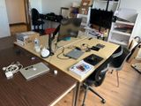 a desk with a computer and a laptop on it